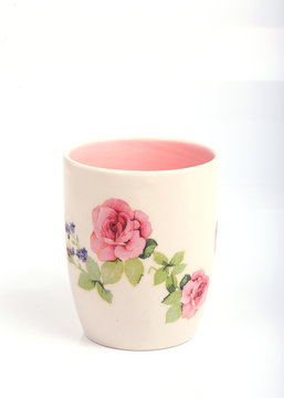 Mug with rose flower pattern isolated