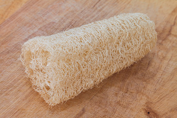 Used loofah on wooden board