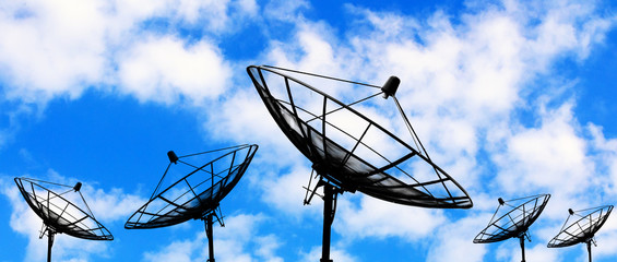Silhouette satellite dish on blue sky