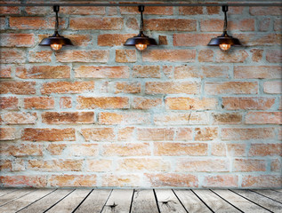 Lamp at brick wall background with ground wood