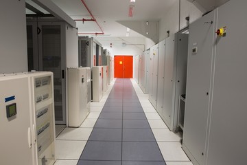 Empty hallway of server towers