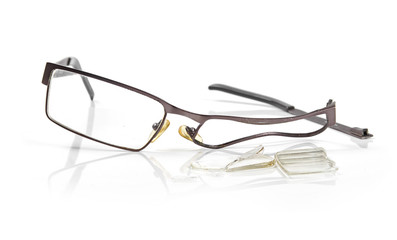 broken eyeglasses isolated on white