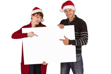 Couple holding a white sign