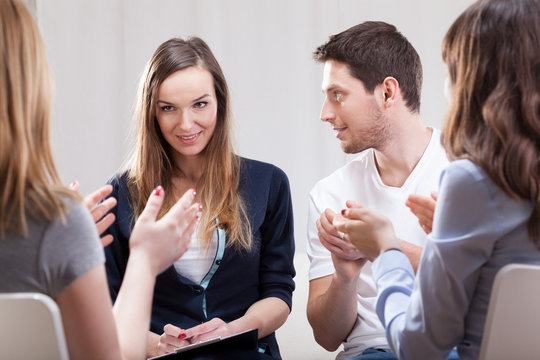 Woman talking about her life on group therapy