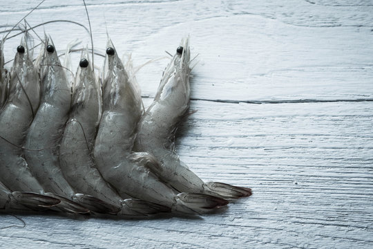 raw shrimp on white wooden