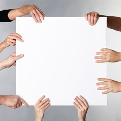 Many hands showcase a white board