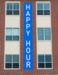 Happy Hour Sign on Brick