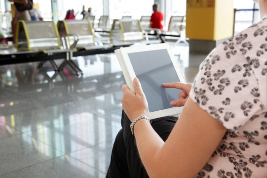 Digital tablet or e-reader at airport