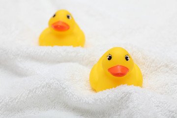 Rubber Ducks on white towel
