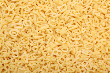 Raw alphabet soup pasta