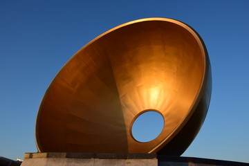 Installation in the form of a bronze bowl with a hole