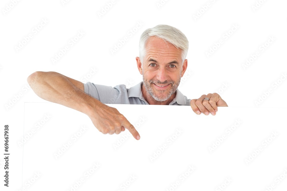 Poster smiling man showing large poster
