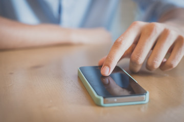 close up man hand using smartphone