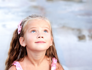 Adorable little girl looking up