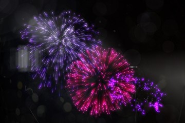 Obraz premium Colourful fireworks exploding on black background