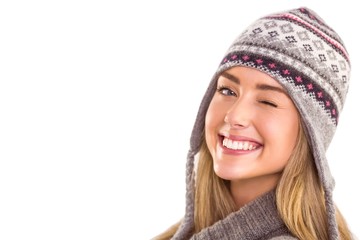 Happy blonde in winter clothes posing
