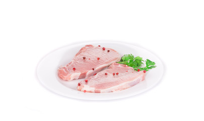 Raw meat on a plate.