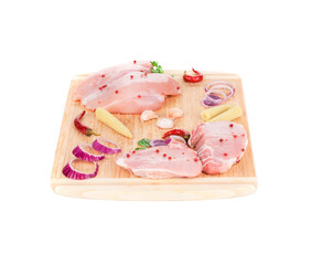 Meat composition on wooden platter.