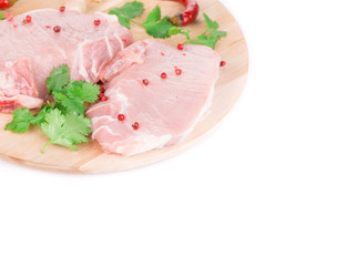 Raw meat on a wooden platter.