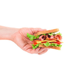 Hand holds french toast sandwich.