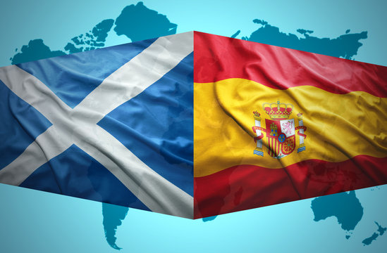 Waving Scottish and Spanish flags