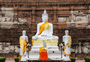 Buddha statues against ancient pagoda at Wat Yai Chaimongkol