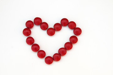 Red candy heart isolated on white background