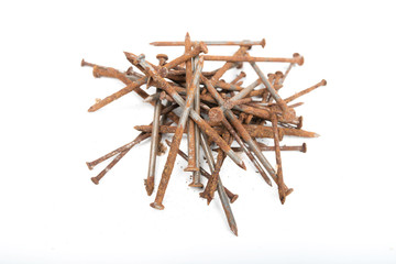 Old rusty pile of iron nails isolated on white background.