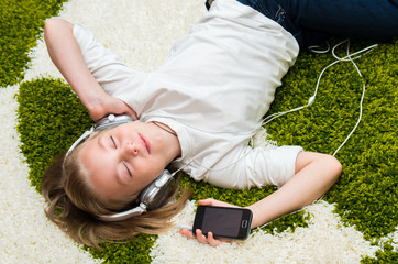 Happy child listening to music.