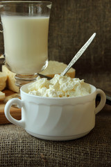 Plate of cottage cheese and a glass of milk.