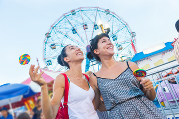 Happy Young Women at Luna Park