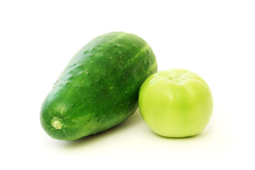 Green tomato and cucumber isolated on a white background