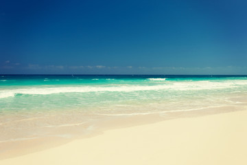 blue sea or ocean, white sand and sky