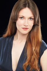Naklejka premium Studio Portrait Of Beautiful Woman Against Black Background