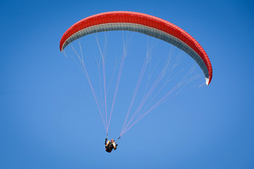 Paraglider in a blue sky