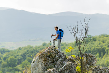 Young man hiking on the mountain