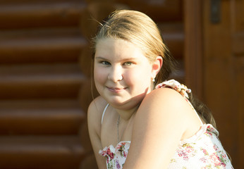 Outdoor portrait of the girl of 11 years old.