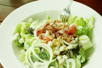 Caesar salad in white bowl.