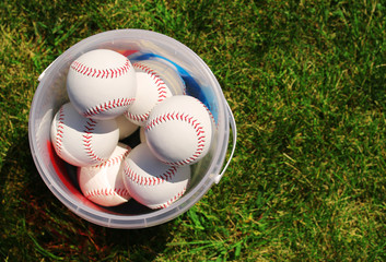 Baseball. Balls in the Basket on Green Grass