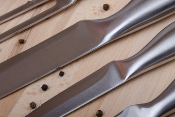 knives in row on wood