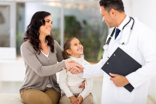 Male Paediatrician Greeting Patient's Mother