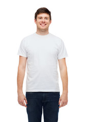 smiling young man in blank white t-shirt