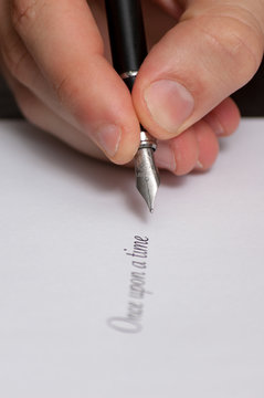 Fountain pen writing the words "Once upon a time"