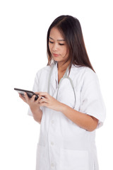 Asian young female doctor look at a tablet pc