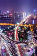 night view of the bridge and city in shanghai china.