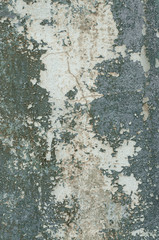 Rough textured blue wall with stains