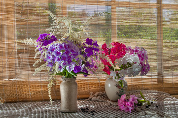 two violet and pink phlox bouquets