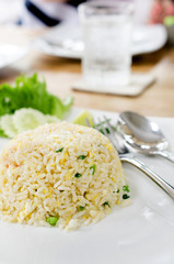 Macro Fried rice thai style on white plate .