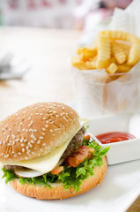 Closeup of home made burgers on table background