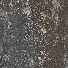 Rough textured wall with stains